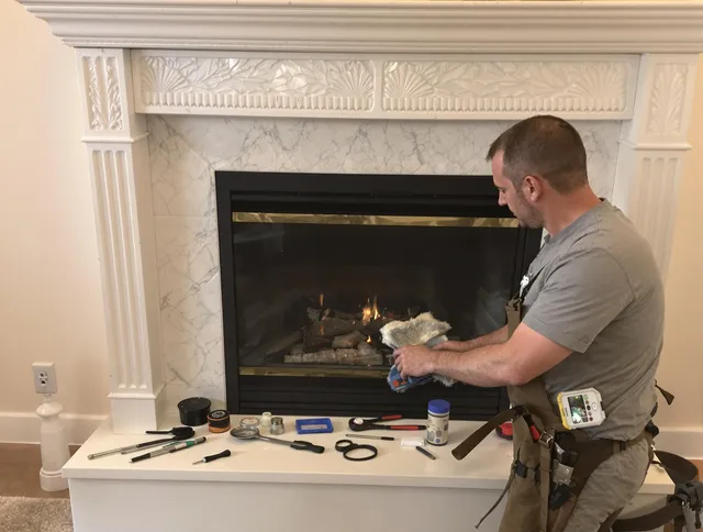 Westborough Chimney Sweep performing fireplace maintenance in Westborough, MA