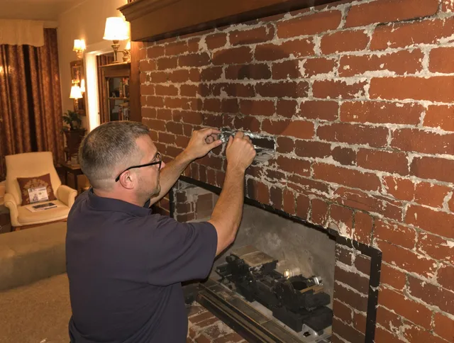 Westborough Chimney Sweep expert fixing a fireplace in Westborough, MA